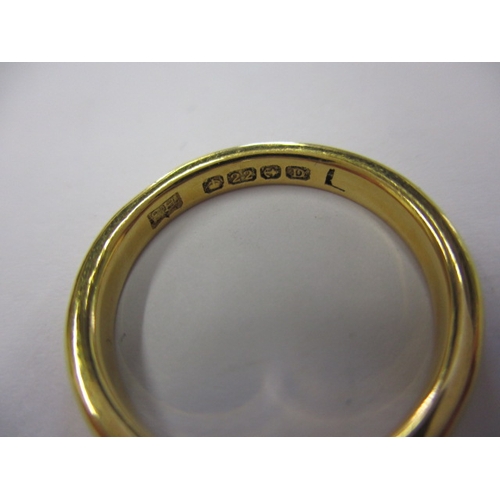 34 - A 22ct yellow gold wedding band, approx. ring size ‘L+’, approx. width 2.6mm, approx. weight 3.9g in... 