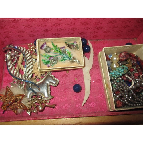 245 - A vintage jewellery box with contents, to include Scottish items and a pair of 9ct gold and turquois... 