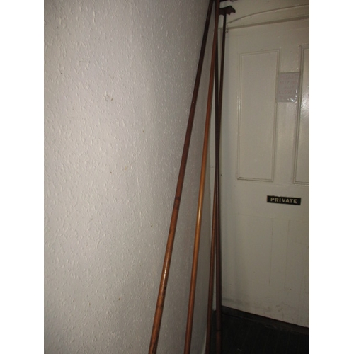 324 - A Victorian mahogany snooker cue stand, a floor standing revolving example, and a large quantity of ... 