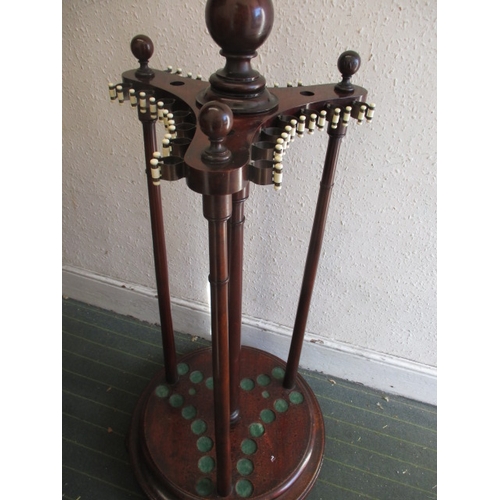 324 - A Victorian mahogany snooker cue stand, a floor standing revolving example, and a large quantity of ... 