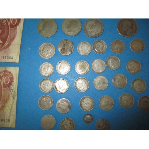 205 - A parcel of Georgian and later coins, to include silver examples and a quantity of 10 shilling notes... 