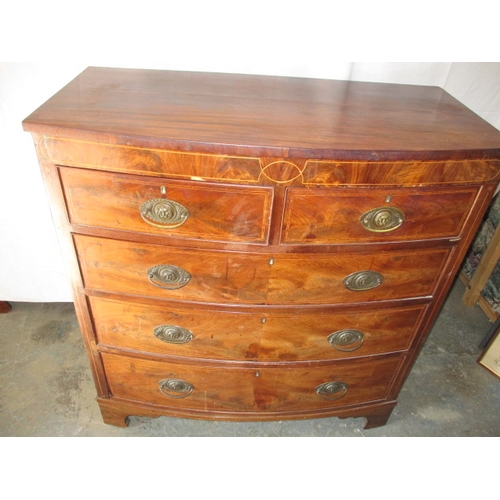 311 - A 19th century mahogany bow fronted chest of 2 short over 3 long graduated drawers. In useable pre-o... 