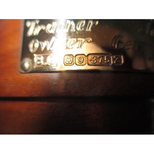 83 - A 9ct gold trophy on wood base with 9ct gold plaque, approx. weight of trophy with out base 165.8g h... 