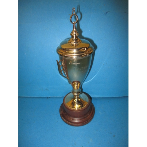 84 - A 9ct gold trophy on wood base, approx. weight of trophy without base 174g, having dedication but no... 