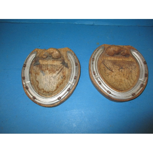 A pair of vintage Robert Thompson (Mouseman) carved wood horseshoe ashtrays, both in pre-owned used condition