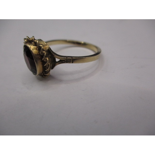 12 - A vintage 9ct gold and garnet dress ring, approx. ring size ‘Q’, approx. weight 2.4g in useable pre-... 