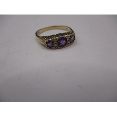 13 - A 9ct gold ring with 3 amethyst and 4 small diamonds, approx. ring size ‘M+’, approx. weight 2g in u... 