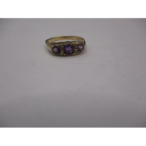 13 - A 9ct gold ring with 3 amethyst and 4 small diamonds, approx. ring size ‘M+’, approx. weight 2g in u... 