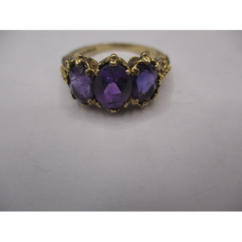 14 - A vintage 9ct gold ring with 3 large amethyst?, approx. ring size ‘O’, approx. weight 4g, in good pr... 