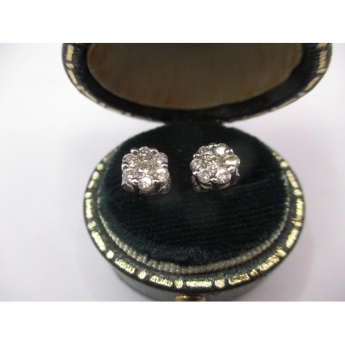 58 - A pair of white gold and diamond 7 stone stud earrings, in useable pre-owned condition