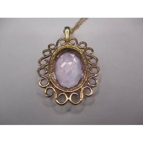 60 - A 9ct gold necklace pendant with large amethyst? Stone and unmarked yellow metal chain, in good pre-... 