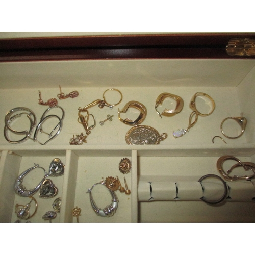 246 - A jewellery box and contents ,to include gold and silver items, all in used condition