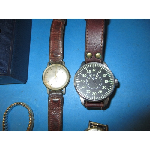 253 - A parcel of vintage wrist watches to include two 9ct gold cased examples, one with gold strap, all i... 