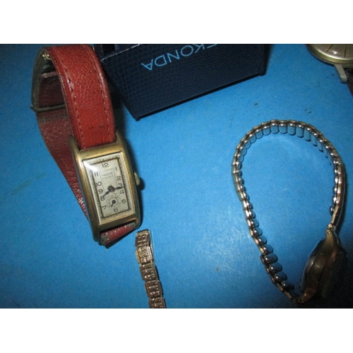 253 - A parcel of vintage wrist watches to include two 9ct gold cased examples, one with gold strap, all i... 