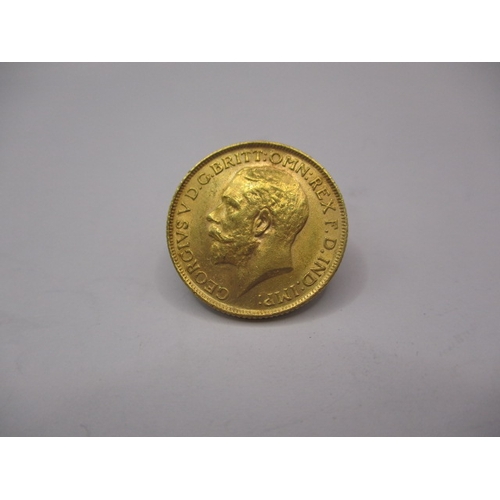 115 - A George V gold sovereign dated 1912, a circulated coin with very fine definition of features