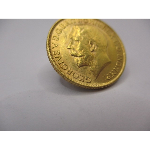 115 - A George V gold sovereign dated 1912, a circulated coin with very fine definition of features