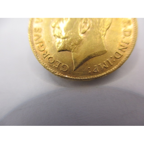 169 - A George V gold half sovereign dated 1911, a circulated coin with fine definition of features, some ... 