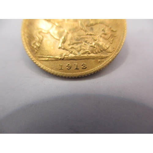 174 - A George V gold half sovereign dated 1913, a circulated coin with very fine definition of features