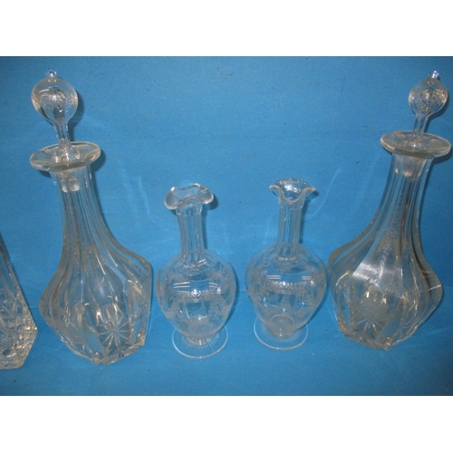 332 - A parcel of vintage drinks decanters, to include lead crystal examples, some with chips to edges, al... 