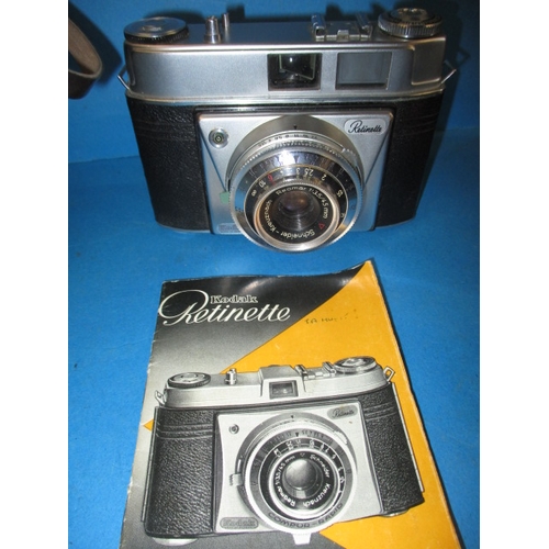 288 - A vintage Lubitel 2 camera and a Kodak Retinette, both in used condition with leather cases and not ... 