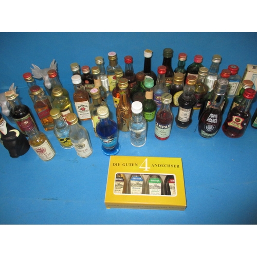 355 - A large quantity of vintage miniature spirits, all unopened and with contents