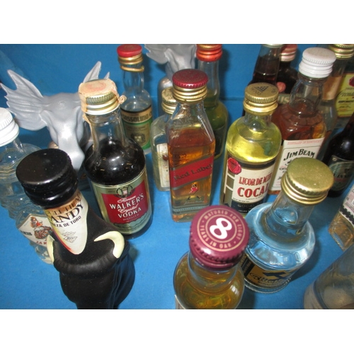 355 - A large quantity of vintage miniature spirits, all unopened and with contents