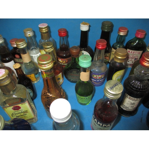 355 - A large quantity of vintage miniature spirits, all unopened and with contents