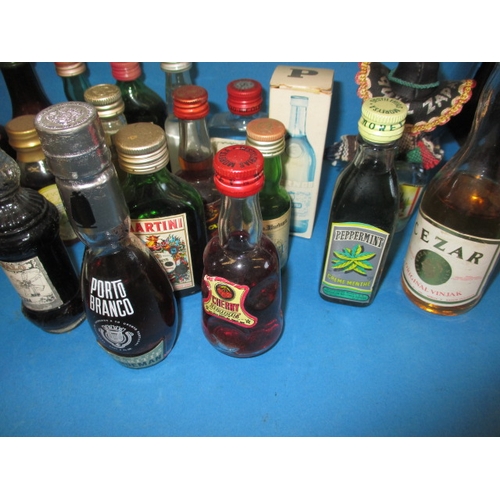 355 - A large quantity of vintage miniature spirits, all unopened and with contents