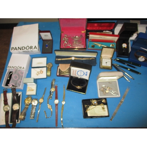 254 - A parcel of vintage watches, jewellery and pens, to include some silver and gold items, and a Pandor... 