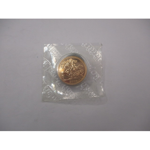 159 - A Royal Mint uncirculated gold sovereign dated 2008, in original vacuum sealed packaging