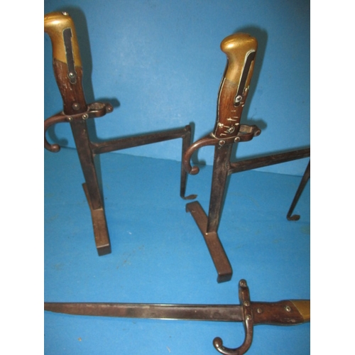 272 - Antique military bayonets formed in to a pair of fire side tool rests and one complete example used ... 