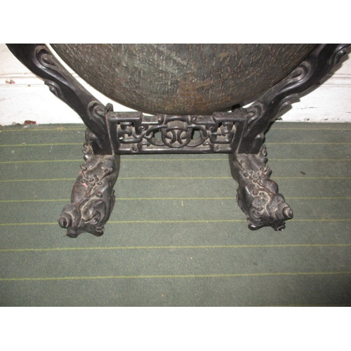 320 - A large Tibetan style temple gong, on carved wood stand, approx. height 112cm, in useable pre-owned ... 