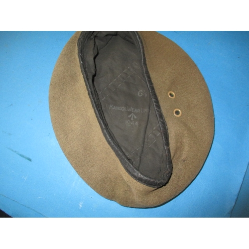 276 - A 1944 dated sand coloured military beret by Kangol, outline of where a badge was fitted which was p... 