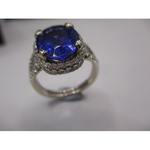 24 - An 18ct white gold diamond and tanzanite ring, the large central AAA quality stone measuring approx.... 