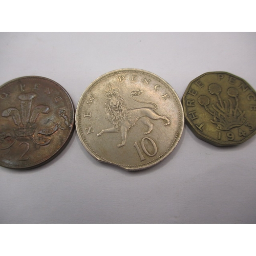 207 - Three Royal Mint error coins, to include a weak strike brass  3d, all circulated, from a private col... 