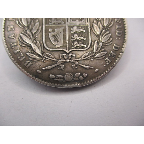 187 - An 1845 silver crown of young Victoria, the truncation marked for W Wyon, a circulated coin with ver... 