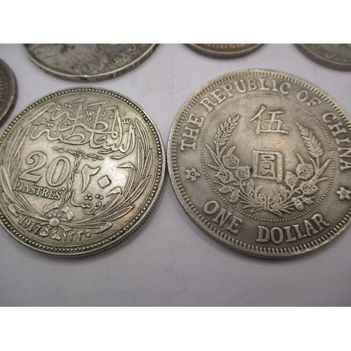 211 - A parcel of vintage world coins, to include silver and part silver examples. Various grades, all cir... 