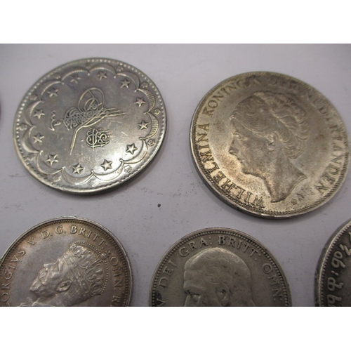 211 - A parcel of vintage world coins, to include silver and part silver examples. Various grades, all cir... 