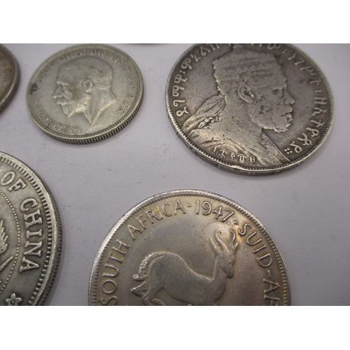 211 - A parcel of vintage world coins, to include silver and part silver examples. Various grades, all cir... 