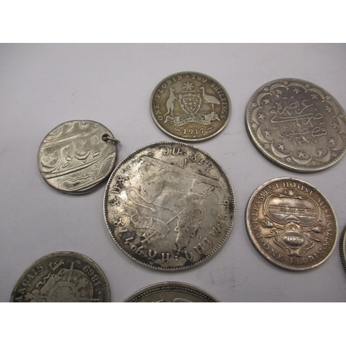 211 - A parcel of vintage world coins, to include silver and part silver examples. Various grades, all cir... 