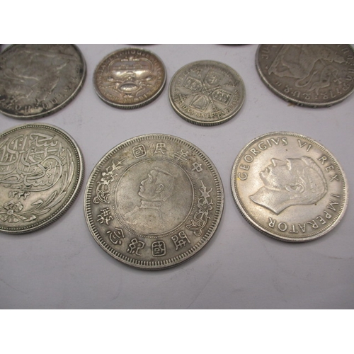 211 - A parcel of vintage world coins, to include silver and part silver examples. Various grades, all cir... 