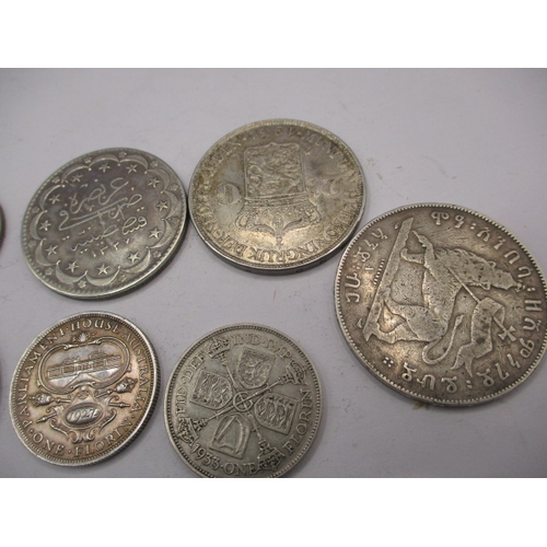 211 - A parcel of vintage world coins, to include silver and part silver examples. Various grades, all cir... 