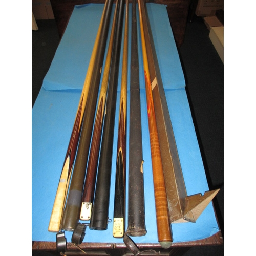 328 - 4 Vintage snooker cues, to include a Joe Davis club and a Peall Record cue, all one piece and in har... 