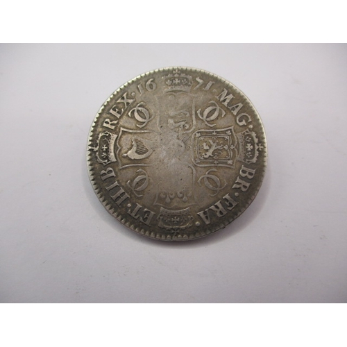 182 - A Charles II half crown dated 1671 and a sixpence dated 1681, both circulated coins with fine defini... 