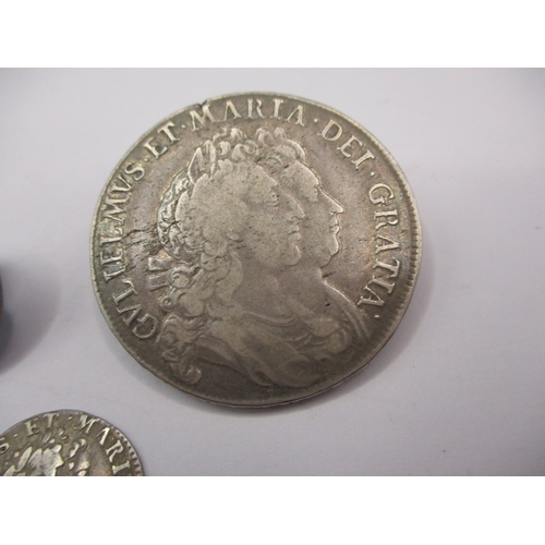 183 - Three William and Mary silver coins, to include a half crown dated 1693, a 4d dated 1690 (drilled) a... 