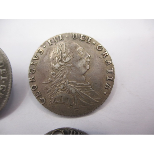 185 - 4 Antique silver coins, to include a William III sixpence dated 1696 a George III sixpence dated 178... 