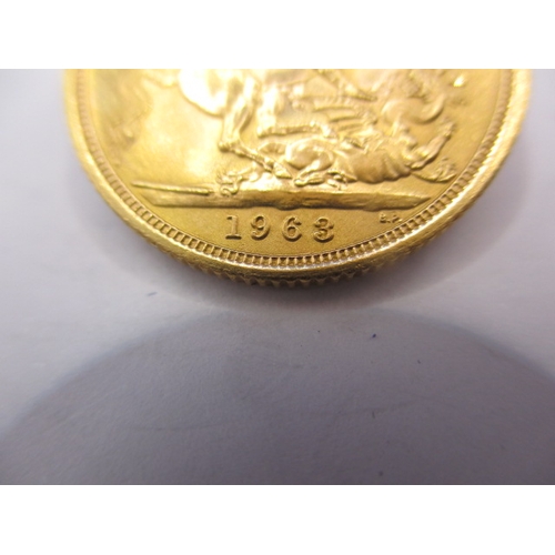 162 - A queen Elizabeth II gold sovereign dated 1963, a circulated coin with very fine definition of featu... 