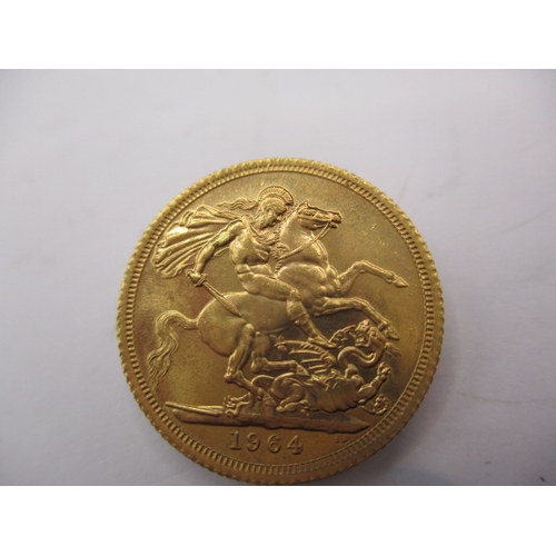 164 - A queen Elizabeth II gold sovereign dated 1964, a circulated coin with very fine definition of featu... 