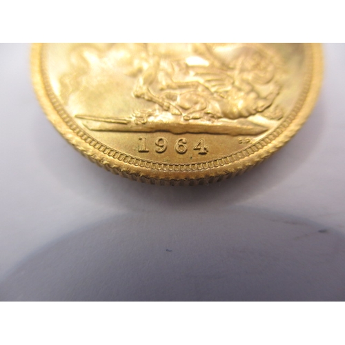 164 - A queen Elizabeth II gold sovereign dated 1964, a circulated coin with very fine definition of featu... 