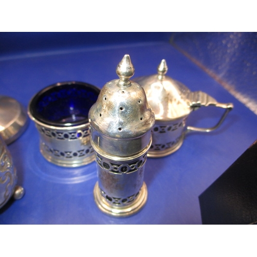 240 - A parcel of silver and white metal fancies, to include cruets cup holder and a ring, all in good pre... 